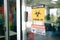 Covid-19 Warning signs stick on the glass door. Quarantine and outbreak alert signs of coronavirus outbreak control