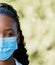 Covid, nurse and portrait at hospital with mask for compliance, safety and healthcare on bokeh mockup background. Face