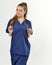 COVID Upload - Healthcare professional in blue scrubs