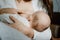 Covid vaccine and breastfeeding. Pregnancy, breastfeeding, fertility and coronavirus. Baby eating mothers milk. Mother
