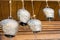 Cow-bells hanging on a wooden beam