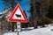 Cow traffic european sign red triangle with mountains on background . Beware of the cow. A warning sign with cattle on european