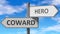 Coward and hero as a choice - pictured as words Coward, hero on road signs to show that when a person makes decision he can choose