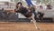 Cowboy On Bucking Bronc In Rodeo