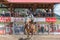 Cowboy on bucking horse during saddle bronc competition at rodeo