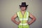 Cowboy builder wearing a high visibility vest