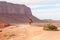 Cowboy caught in sun on rock bluff in Monument Valley Utah USA