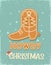 Cowboy Christmas gingerbread boot cookie vintage card illustration with christmas text on old paper texture.