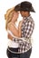 Cowboy couple rope around them ready to kiss