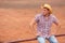 Cowboy farmer man in country side looking away at desert land countryside ranch wearing western hat. Happy American Male