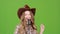 Cowboy girl sings country songs in a bar. Green screen