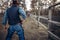 Cowboy with gun prepares to gunfight, back view