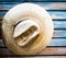 Cowboy hat on blue plank wall