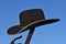 Cowboy hat resting on top of a lever