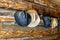 Cowboy hats on a log cabin wall