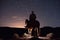 Cowboy on horse star gazing at night sky, created using generative ai technology