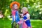 Cowboy kids playing with toy horse