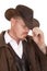 Cowboy leather coat hat close head look down