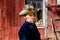 Cowboy Looking at you in front of Barn