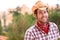 Cowboy man smiling happy wearing hat in country