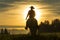 Cowboy riding across grassland with mountains in the background