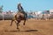 Cowboy Riding A Bucking Bull At A Country Rodeo