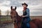 Cowboy riding a horse on texas farm