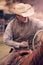 Cowboy roping calves on a cattle ranch