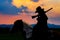 Cowboy silhouette on horse during nice sunset