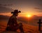 Cowboy sitting on hill with sunset grieving lost loved one