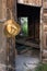 Cowboy straw hat and opened doors of old barn