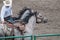 Cowboy with two dapple gray horses at rodeo