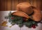 Cowboy western hat and Christmas decoration on wood background