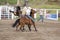 Cowboys competing in Ranch Bronc Riding