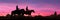Cowboys couple on horseback at sunset