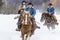 Cowboys Herding Horses In The Snow