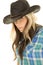 Cowgirl blue shirt black hat close look