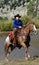 Cowgirl & Horse Emerging from Pond