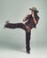 Cowgirl, kick and fight with fists in studio for western character, wild west outfit and hat for sheriff. Female person
