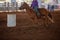 Cowgirl Rides At Speed In Barrel Racing Competition At Rodeo