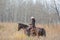 Cowgirl riding her horse