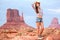 Cowgirl woman tourist travel in Monument Valley