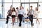 Coworkers posing to camera in meeting room