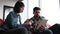 Coworkers reading on tablet and laptop screens in office