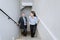 Coworkers talking on the stairs of an office