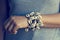 Cowrie shell bracelets on the wrist of woman