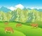 Cows on the Alpine meadows.Mountains range and green valley.