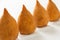 Coxinha is a deep fried food, traditional in Brazil. Three snack