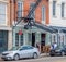 Coyote Ugly Saloon and Three People in the French Quarter