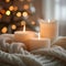 Cozy ambiance with three lit candles on a soft knit blanket, warm glow against a bokeh light background.